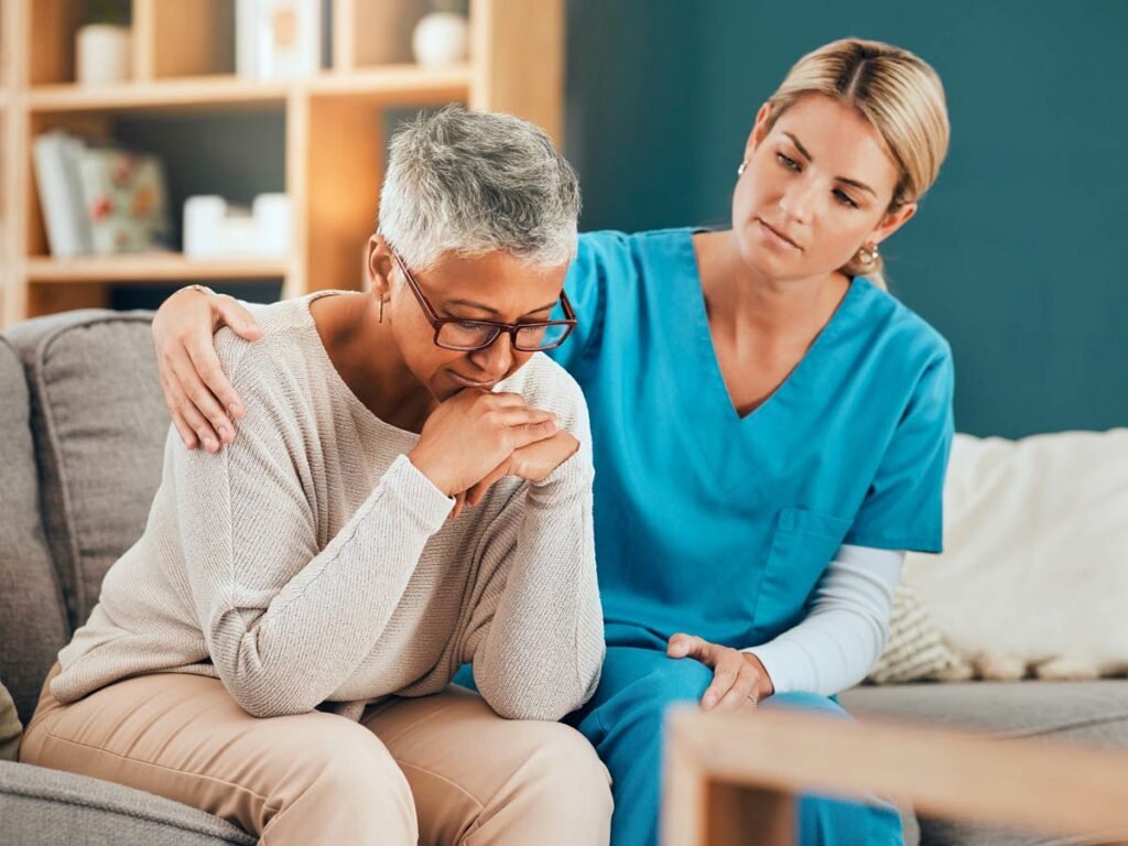 A hospice nurse provides comfort and solace to a woman coming to grips with a loved one's terminal diagnosis and the necessity of hospice care. Compassion and support in a challenging moment. 