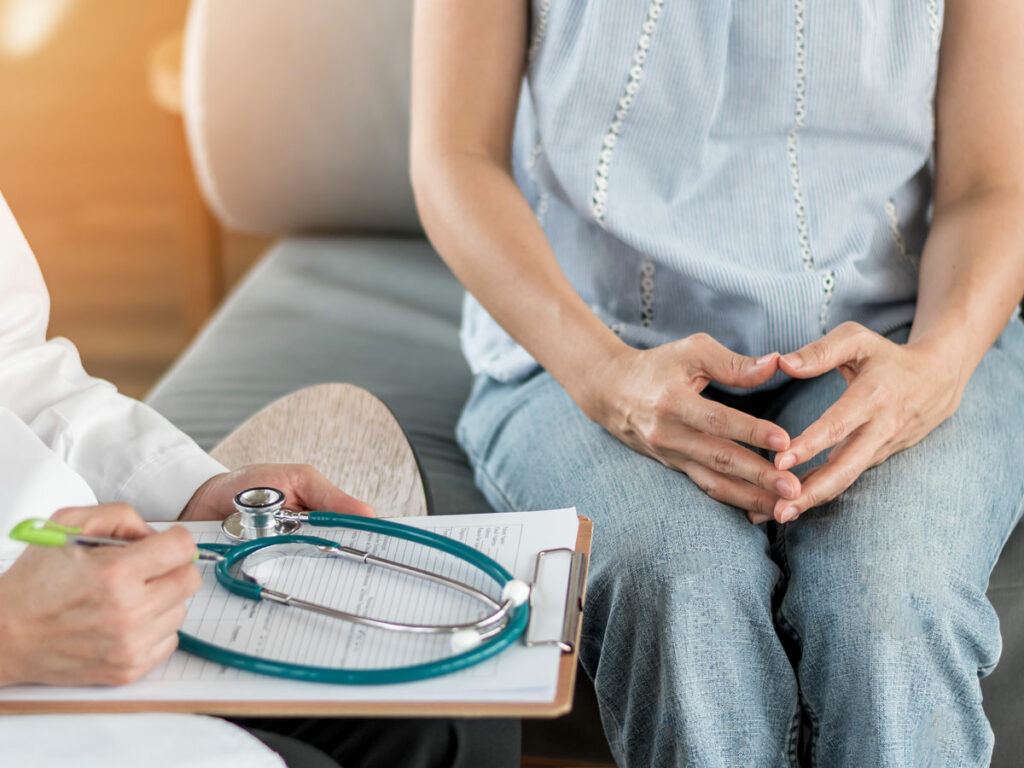 Expert Analysis: An oncologist carefully reviews test results, focusing on ovarian cancer diagnostics. This candid moment captures the dedication and expertise of medical professionals in the battle against cancer.